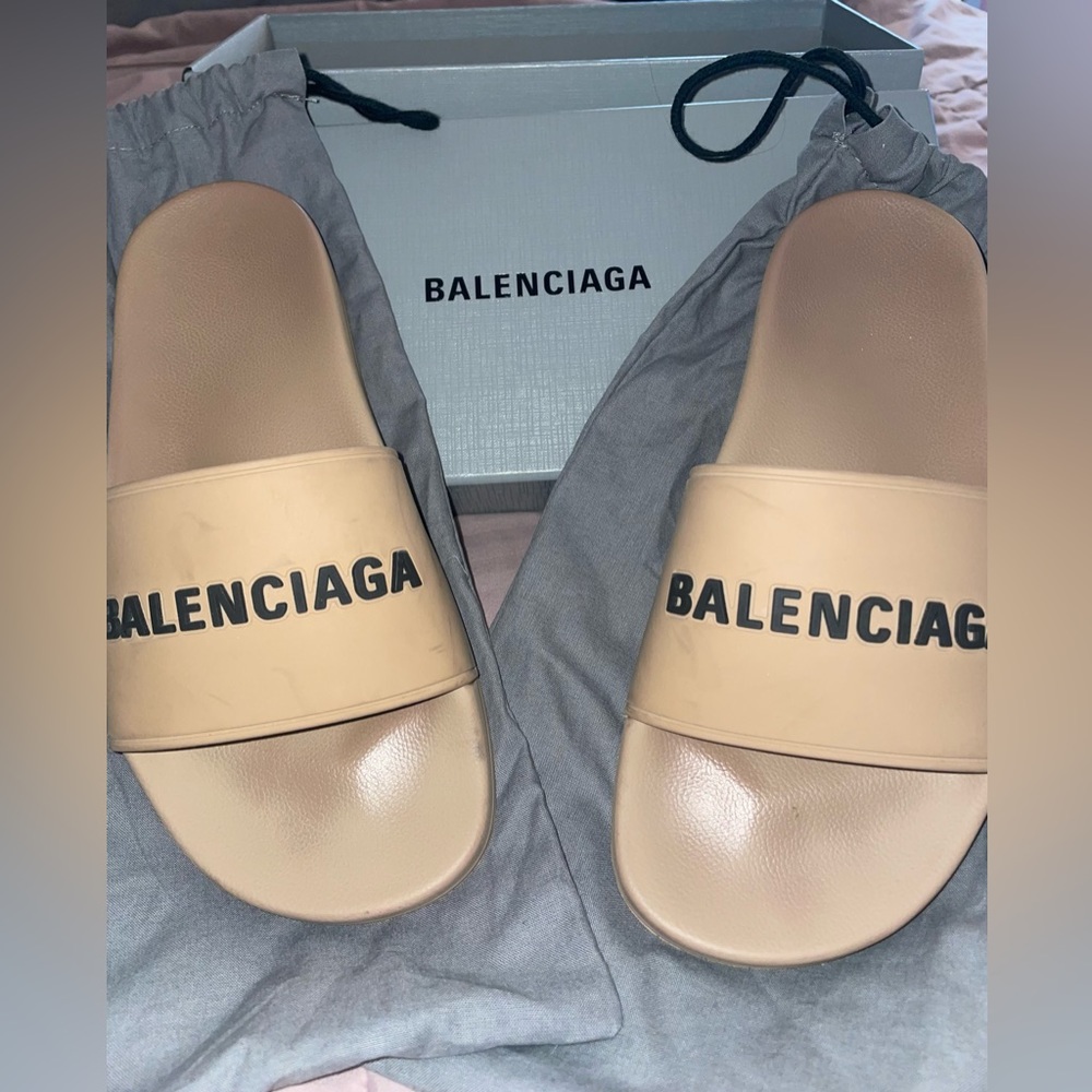 Tan Balenciaga slides.